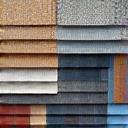 A collection of roofing shingle and siding color samples.